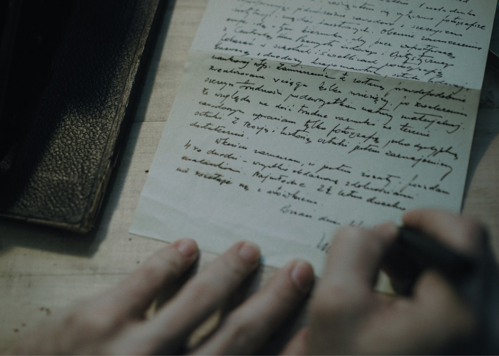 Person writing a letter